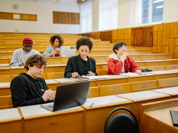 University student looking at a laptop screen affected by the Canvas data breach security alert