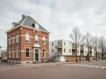 Editorial visual about realistic Dutch public administration exterior: modest municipal-style building and tempor