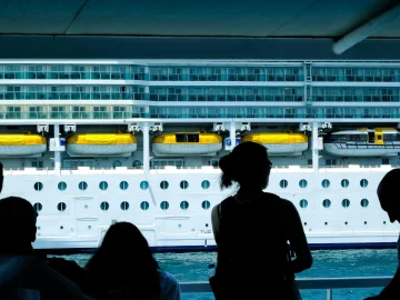 Passengers on a cruise ship deck during a norovirus cruise ship outbreak response