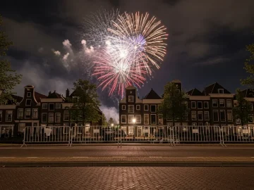 News image about realistic Dutch New Year fireworks policy stock photo: public fireworks display over canal