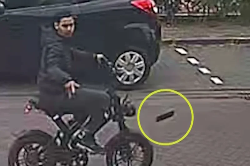 Still from police camera footage showing a young man riding away on a stolen fatbike in Diemen